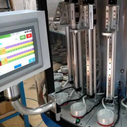 Custom automated assembly machine designed and manufactured by Sigma Design Company Custom automated assembly machine designed and manufactured by Sigma Design Company